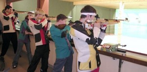 People testing out their air rifle target skills. Source: Wikipedia. 