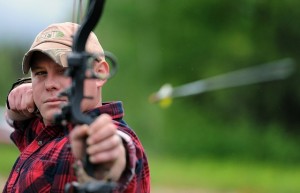 A recurve bow, with sights, in action